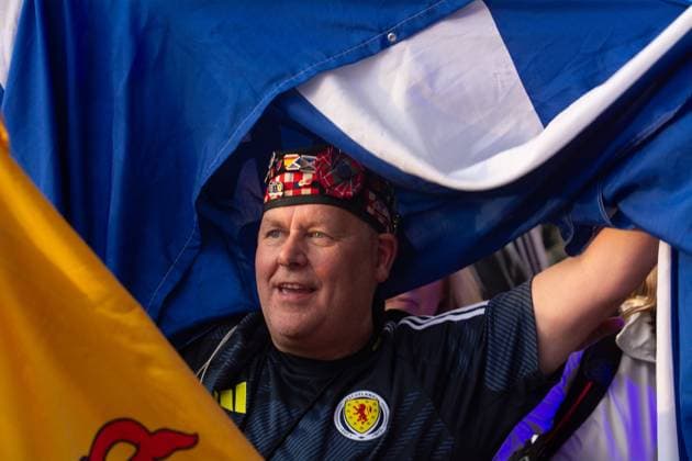 Public View Of Germany V Scotland In Cologne A Scotland fan is singing the anthem as thousands of German and Scotland football fans are gathering at Tanzbrunnen to watch the public viewing of the opening match between Germany and Scotland of UEFA EURO, EM, Europameisterschaft,Fussball 2024 in Cologne, Germany, on June 14, 2024. cologne Germany  Copyright: xYingxTangx originalFilename:tang-notitle240614_npSrT.jpg