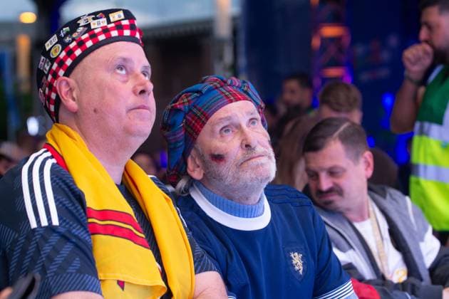 Public View Of Germany V Scotland In Cologne Two Scotland fans are looking sad as thousands of German and Scotland football fans are gathering at Tanzbrunnen to watch the public viewing of the opening match between Germany and Scotland of UEFA EURO, EM, Europameisterschaft,Fussball 2024 in Cologne, Germany, on June 14, 2024. cologne Germany  Copyright: xYingxTangx originalFilename:tang-notitle240614_npRvj.jpg