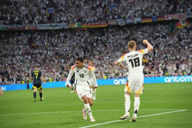 EURO 2024 - Matchday 1: Germany vs. Scotland Jamal Musiala scores and celebrates with his teammates during the EURO 2024 Day 1 opening match between Germany and Scotland on 14 June 2024, at Munich Football Arena, in Munich, Germany Munich Munich Football Arena Germany Copyright: xAlexandraxFechetex DSC0018301