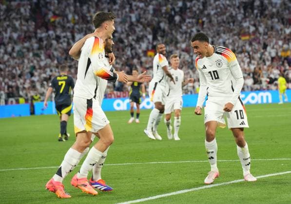 EURO 2024 - Matchday 1: Germany vs. Scotland Jamal Musiala scores and celebrates with his teammates during the EURO 2024 Day 1 opening match between Germany and Scotland on 14 June 2024, at Munich Football Arena, in Munich, Germany Munich Munich Football Arena Germany Copyright: xAlexandraxFechetex DSC0019101