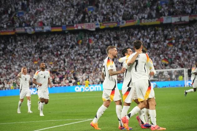 EURO 2024 - Matchday 1: Germany vs. Scotland Jamal Musiala scores and celebrates with his teammates during the EURO 2024 Day 1 opening match between Germany and Scotland on 14 June 2024, at Munich Football Arena, in Munich, Germany Munich Munich Football Arena Germany Copyright: xAlexandraxFechetex DSC0021201
