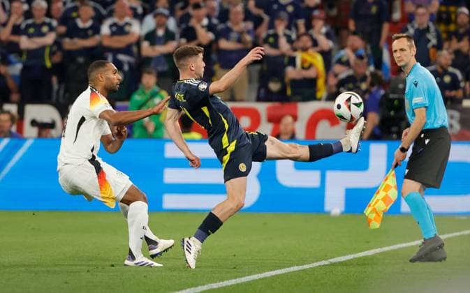14 06 2024, European Football Championship, Germany vs Scotland, Allianz Arena Munich, Sport, in the picture Jonathan Tah Germany vs Ryan Christie Scotland