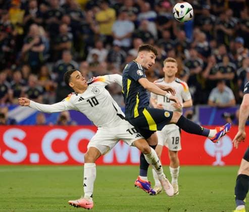 14 06 2024, European Football Championship, Germany vs Scotland, Allianz Arena Munich, Sport, in the picture Jamal Musiala Germany vs Callum McGregor Scotland