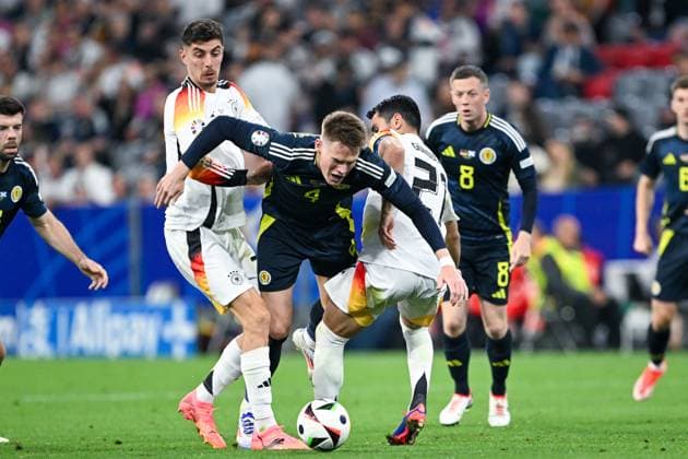 Euro 2024 Germany Scotland on 14 06 2024 at the Allianz Arena in Munich Kai Havertz Germany in a duel against Scott McTominay of Scotland and Ilkay Gündogan Guendogan Germany MT