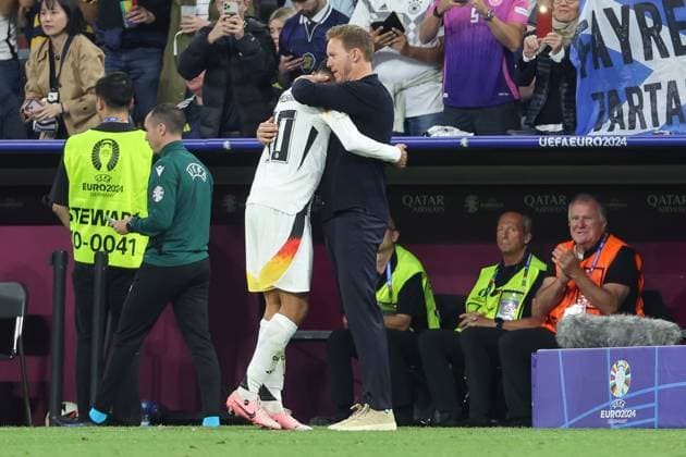 Euro 2024 Germany Scotland on 14 06 2024 at the Allianz Arena in Munich Coach Head Coach Julian Nagelsmann Germany hugs Jamal Musiala Germany 10 MH