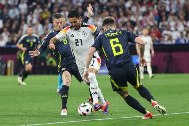 Euro 2024 Germany Scotland on 14 06 2024 at the Allianz Arena in Munich Ilkay Gündogan Guendogan Germany 21 vs Callum McGregor Scotland 8 and Kieran Tierney Scotland 6 MH