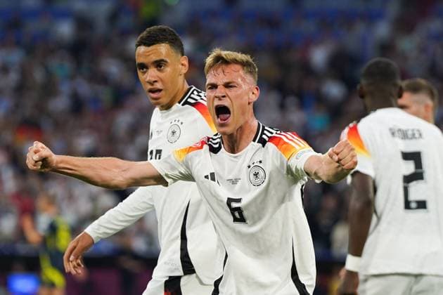 (240615) -- MUNICH, June 15, 2024 -- Joshua Kimmich (front) of Germany celebrates during the UEFA EURO, EM, Europameisterschaft,Fussball 2024 Group A match between Germany and Scotland in Munich, Germany on June 14, 2024. ) (SP)GERMANY-MUNICH-FOOTBALL-EURO 2024-GERMANY VS SCOTLAND PengxZiyang 