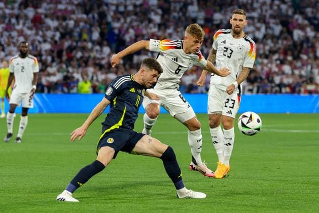 in duel, action, with Ryan Christie 11 Scotland , Joshua Kimmich 6 Germany , Germany vs Scotland, Football, UEFA Euro 2024, Group stage, 1 Matchday, 14 06 2024 DFB regulations prohibit any use of photographs as image sequences and or quasi video Muenchen Bayern Germany Copyright: xkolbert-press ChristianxKolbertx
