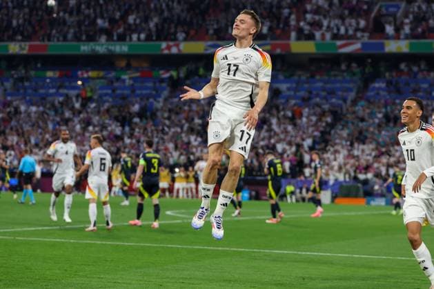 Goal celebration by Florian Wirtz 17 Germany for 1 0, Germany vs Scotland, Football, UEFA Euro 2024, Group stage, 1 Matchday, 14 06 2024 DFB regulations prohibit any use of photographs as image sequences and or quasi video Muenchen Bayern Germany Copyright: xkolbert-press ChristianxKolbertx