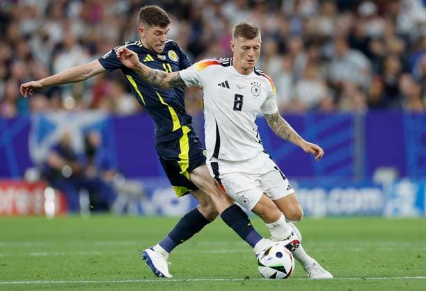 14 06 2024, Football, European Championship, Germany Scotland, GER, Munich, Munich Football Arena, picture from left Ryan Christie Scotland, 11 and Toni Kroos Germany, 8 Copyright: HMBxMedia xHeikoxBecker