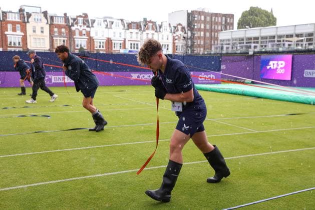 15th June 2024; Cinch Championships, Queens Club, West Kensington, London, England: Cinch Championships Queens Club, Qualifying Day 1; Groundsmen putting the covers back on court 1 due to heavy rain  ActionPlus12654752 JohnxPatrickxFletcher