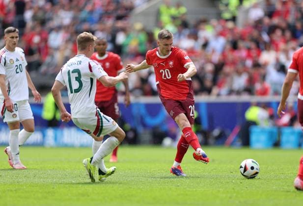 15 06 2024, European Football Championship, UEFA EURO 2024, Hungary Switzerland, Group A, Cologne Stadium, f l , Andras Schäfer Hungary , Michel Aebischer Switzerland Copyright: HMBxMedia