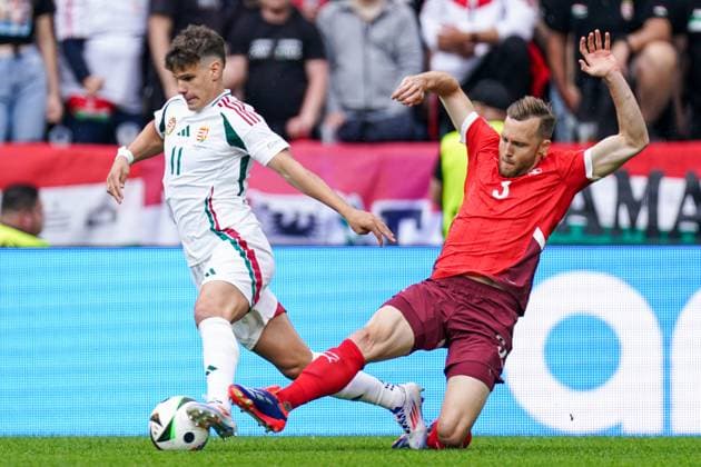 2024-06-15 Hungary v Switzerland - Group A - UEFA EURO, EM, Europameisterschaft,Fussball 2024 COLOGNE, GERMANY - JUNE 15: Milos Kerkez of Hungary gets tackled by Silvan Widmer of Switzerland during the Group A - UEFA EURO 2024 match between Hungary and Switzerland at Cologne Stadium on June 15, 2024 in Cologne, Germany. (Photo by Joris Verwijst BSR Agency) Cologne Germany Content not available for redistribution in The Netherlands directly or indirectly through any third parties. Copyright: xBSRxAgencyx