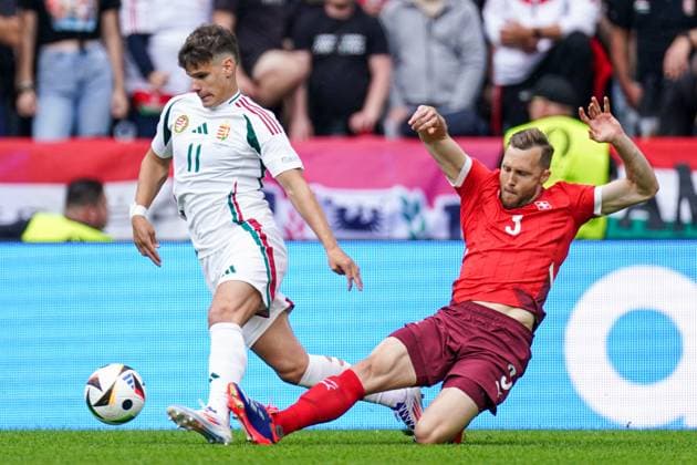 2024-06-15 Hungary v Switzerland - Group A - UEFA EURO, EM, Europameisterschaft,Fussball 2024 COLOGNE, GERMANY - JUNE 15: Milos Kerkez of Hungary gets tackled by Silvan Widmer of Switzerland during the Group A - UEFA EURO 2024 match between Hungary and Switzerland at Cologne Stadium on June 15, 2024 in Cologne, Germany. (Photo by Joris Verwijst BSR Agency) Cologne Germany Content not available for redistribution in The Netherlands directly or indirectly through any third parties. Copyright: xBSRxAgencyx