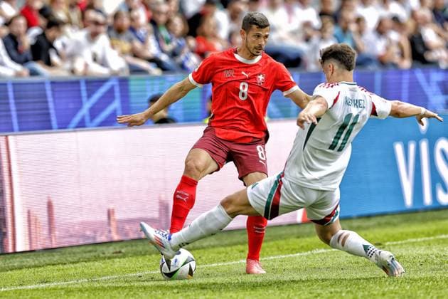 COLOGNE, RheinEnergie Stadium, 15-06-2024 , European Football Championship Euro2024, Group stage match no.2 between Hungary and Switzerland. Hungary player Milos Kerkez and Switzerland player Remo Freuler Hungary - Switzerland (Euro2024)  x25494560x Copyright: