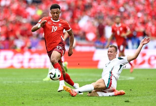 Ãdam Lang of Hungary tackles Dan Ndoye of Switzerland Hungary v Switzerland, UEFA European Championship, EM, Europameisterschaft 2024, Group A, Football, Cologne Stadium, Cologne, Germany, 15 Jun 2024 EDITORIAL USE ONLY No use with unauthorised audio, video, data, fixture lists, club league logos or live services. Online in-match use limited to 120 images, no video emulation. No use in betting, games or single club league player publications. Copyright: xMichaelxZemanek Shutterstockx 14539265am