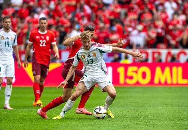 Football, Men, Season 2023 24, Euro 2024 Group A 1 Matchday in Cologne, Hungary Switzerland, f l Remo Freuler Switzerland , Andras Schäfer Hungary , 15 06 2024, Copyright: xSebastianxRäppold MatthiasxKochx