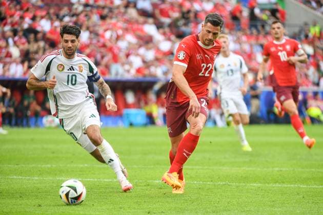 COLOGNE, GERMANY JUNE 15 Fabian Schar of Switzerland R against Dominik Szoboszlai of Hungary L during the UEFA EURO 2024 group stage match between Hungary and Switzerland at Cologne Stadium on June 15, 2024 in Cologne, Germany Cologne Cologne Stadium North Rhine Westphalia Germany Copyright: xJustPictures.ch ManuelxWinterbergerx jp-en-EuSpIm-MWI_7721