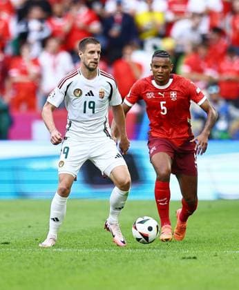 Barnabas Varga of Hungary is pressured by Manuel Akanji of Switzerland Hungary v Switzerland, UEFA European Championship, EM, Europameisterschaft 2024, Group A, Football, Cologne Stadium, Cologne, Germany, 15 Jun 2024 EDITORIAL USE ONLY No use with unauthorised audio, video, data, fixture lists, club league logos or live services. Online in-match use limited to 120 images, no video emulation. No use in betting, games or single club league player publications.  Copyright: xMichaelxZemanek Shutterstockx 14539265bh