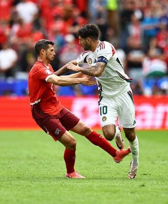 Dominik Szoboszlai of Hungary is fouled by Remo Freuler of Switzerland Hungary v Switzerland, UEFA European Championship, EM, Europameisterschaft 2024, Group A, Football, Cologne Stadium, Cologne, Germany, 15 Jun 2024 EDITORIAL USE ONLY No use with unauthorised audio, video, data, fixture lists, club league logos or live services. Online in-match use limited to 120 images, no video emulation. No use in betting, games or single club league player publications.  Copyright: xMichaelxZemanek Shutterstockx 14539265bm
