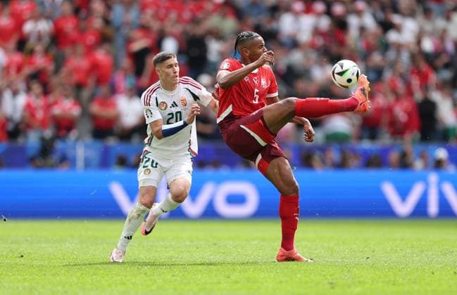 15 06 2024, European Football Championship, UEFA EURO 2024, Hungary Switzerland, Group A, Cologne Stadium, v l , Roland Sallai Hungary , Manuel Akanji Switzerland Copyright: HMBxMedia