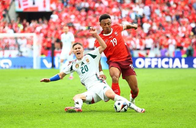 Roland Sallai of Hungary is fouled by Dan Ndoye of Switzerland Hungary v Switzerland, UEFA European Championship, EM, Europameisterschaft 2024, Group A, Football, Cologne Stadium, Cologne, Germany, 15 Jun 2024 EDITORIAL USE ONLY No use with unauthorised audio, video, data, fixture lists, club league logos or live services. Online in-match use limited to 120 images, no video emulation. No use in betting, games or single club league player publications.  Copyright: xMichaelxZemanek Shutterstockx 14539265bn