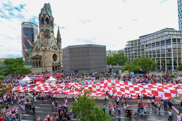 UEFA EURO, EM, Europameisterschaft,Fussball 2024: Croatian fans display 107-meter flag Croatian fans carry 107 meters long Croatian flag at Waldorf Astoria Square in Berlin, Germany, on June 15, 2024. ahead of the UEFA Euro 2024 group B match between Spain and Croatia. SanjinxStrukic PIXSELL