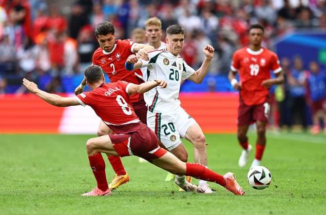 Roland Sallai of Hungary is challenged by Leonidas Stergiou of Switzerland and Remo Freuler of Switzerland Hungary v Switzerland, UEFA European Championship, EM, Europameisterschaft 2024, Group A, Football, Cologne Stadium, Cologne, Germany, 15 Jun 2024 EDITORIAL USE ONLY No use with unauthorised audio, video, data, fixture lists, club league logos or live services. Online in-match use limited to 120 images, no video emulation. No use in betting, games or single club league player publications.  Copyright: xMichaelxZemanek Shutterstockx 14539265bw