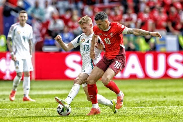 COLOGNE, RheinEnergie Stadium, 15-06-2024 , European Football Championship Euro2024, Group stage match no.2 between Hungary and Switzerland. Hungary player Andras Schafer and Switzerland player Granit Xhaka Hungary - Switzerland (Euro2024)  x25495248x Copyright: