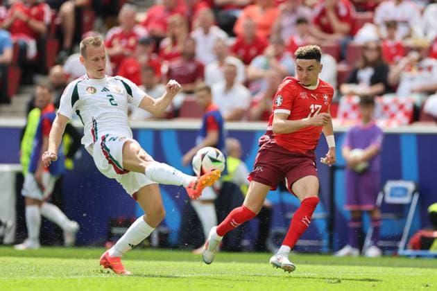 (240615) -- COLOGNE, June 15, 2024 -- Adam Lang (L) of Hungary vies with Ruben Vargas of Switzerland the UEFA EURO, EM, Europameisterschaft,Fussball 2024 Group A match between Hungary and Switzerland in Cologne, Germany, June 15, 2024. ) (SP)GERMANY-COLOGNE-FOOTBALL-EURO 2024-SWITZERLAND VS HUNGARY MengxDingbo 