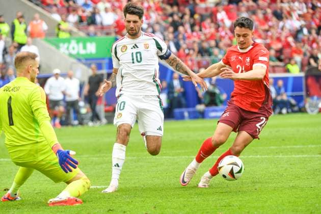 COLOGNE, GERMANY JUNE 15 Fabian Rieder of Switzerland R against Dominik Szoboszlai of Hungary C and goalkeeper Peter Gulacsi of Hungary L during the UEFA EURO 2024 group stage match between Hungary and Switzerland at Cologne Stadium on June 15, 2024 in Cologne, Germany Cologne Cologne Stadium North Rhine Westphalia Germany Copyright: xJustPictures.ch ManuelxWinterbergerx jp-en-EuSpIm-MWI_7898