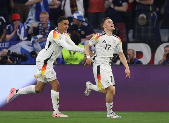 - Germany v Scotland, UEFA EURO, EM, Europameisterschaft,Fussball 2024, Group Stage, Group A, Allianz Arena, Munich Football Arena, Germany - 14th June 2024. GOAL Florian Wirtz of Germany & Bayer 04 Leverkusen goal celebration with Jamal Musiala of Germany & FC Bayern Munich. - Germany v Scotland, UEFA Euro 2024, Group Stage, Group A, Allianz Arena, Munich Football Arena, Munich, Germany - 14th June 2024. Munich Allianz Arena, Munich Football Arena Germany Copyright: xDanxWeirx CP_Germany_Scotland_162