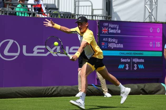 15th June 2024; Cinch Championships, Queens Club, West Kensington, London, England: Cinch Championships Queens Club, Qualifying Day 1; Henry Searle (GBR) with a backhand shot to Rinky Hijikata (AUS)  ActionPlus12654904 JohnxPatrickxFletcher