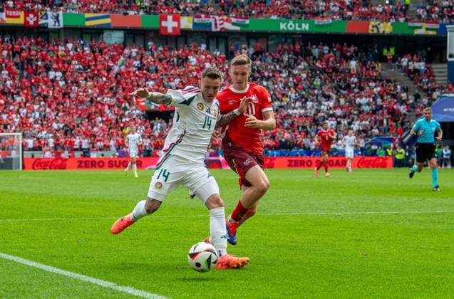 Football, Men, Season 2023 24, Euro 2024 Group A 1 Matchday in Cologne, Hungary Switzerland, v l Bendeguz Bolla Hungary , Michel Aebischer Switzerland , 15 06 2024, Copyright: xSebastianxRäppold MatthiasxKochx
