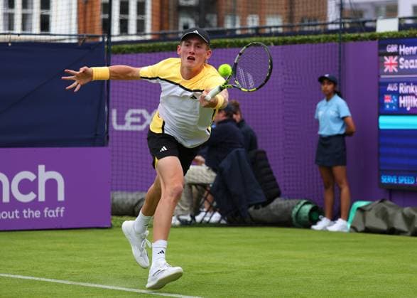 15th June 2024; Cinch Championships, Queens Club, West Kensington, London, England: Cinch Championships Queens Club, Qualifying Day 1; Henry Searle (GBR) with a forehand shot to Rinky Hijikata (AUS)  ActionPlus12654914 JohnxPatrickxFletcher