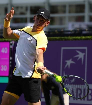 15th June 2024; Cinch Championships, Queens Club, West Kensington, London, England: Cinch Championships Queens Club, Qualifying Day 1; Henry Searle (GBR) with a forehand shot to Rinky Hijikata (AUS)  ActionPlus12654916 JohnxPatrickxFletcher