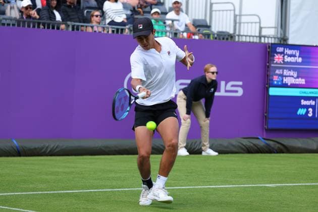15th June 2024; Cinch Championships, Queens Club, West Kensington, London, England: Cinch Championships Queens Club, Qualifying Day 1; Rinky Hijikata (AUS) with a forehand shot to Henry Searle (GBR)  ActionPlus12654917 JohnxPatrickxFletcher