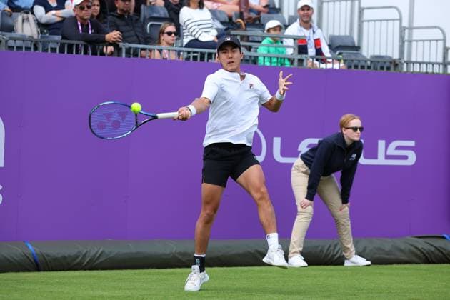 15th June 2024; Cinch Championships, Queens Club, West Kensington, London, England: Cinch Championships Queens Club, Qualifying Day 1; Rinky Hijikata (AUS) with a forehand shot to Henry Searle (GBR)  ActionPlus12654919 JohnxPatrickxFletcher