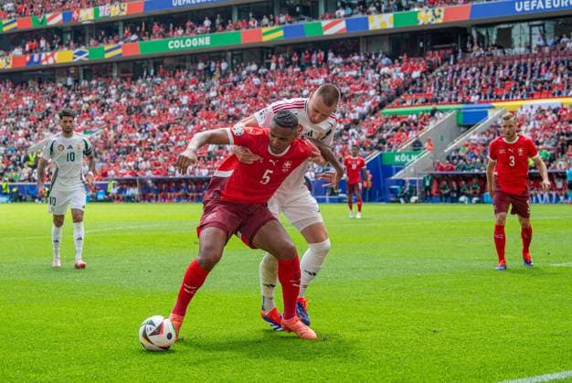 Football, Men, Season 2023 24, Euro 2024 Group A 1 Matchday in Cologne, Hungary Switzerland, v l Manuel Akanji Switzerland , Attila Szalai Hungary , 15 06 2024, Copyright: xSebastianxRäppold MatthiasxKochx