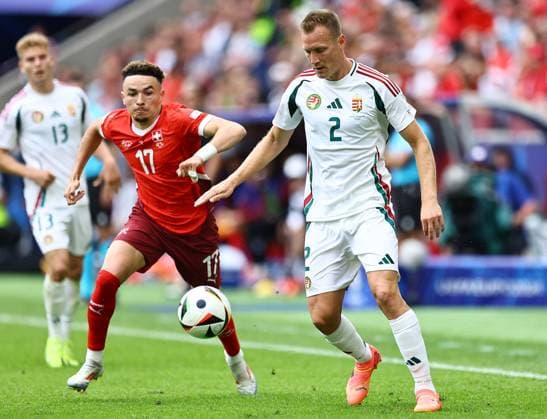 Ãdam Lang of Hungary is pressured by Ruben Vargas of Switzerland Hungary v Switzerland, UEFA European Championship, EM, Europameisterschaft 2024, Group A, Football, Cologne Stadium, Cologne, Germany, 15 Jun 2024 EDITORIAL USE ONLY No use with unauthorised audio, video, data, fixture lists, club league logos or live services. Online in-match use limited to 120 images, no video emulation. No use in betting, games or single club league player publications.  Copyright: xMichaelxZemanek Shutterstockx 14539265cx