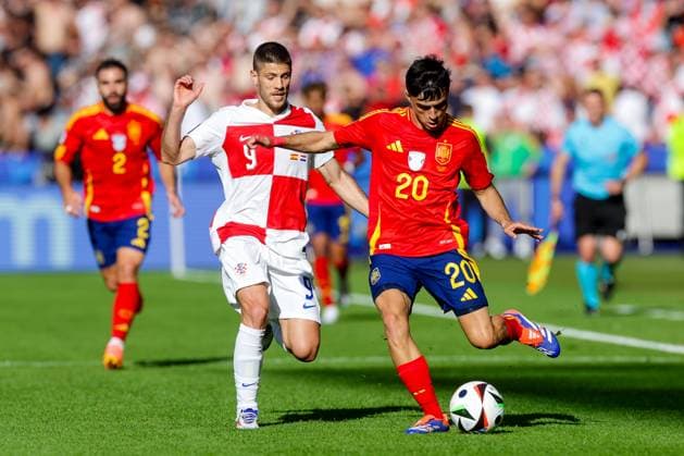 Spain v Croatia: Group B - UEFA EURO, EM, Europameisterschaft,Fussball 2024 BERLIN, GERMANY - JUNE 15: Andrej Kramaric of Croatia competes for the ball with Pedri of Spain during the UEFA EURO 2024 group stage match between Spain and Croatia at Olympiastadion on June 15, 2024 in Berlin, Germany. LukaxStanzl PIXSELL