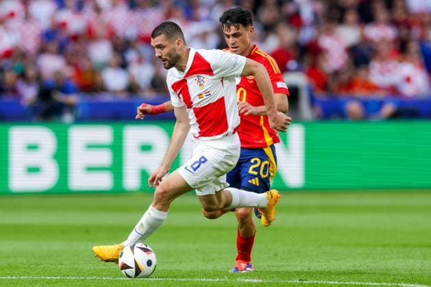 Spain v Croatia: Group B - UEFA EURO, EM, Europameisterschaft,Fussball 2024 BERLIN, GERMANY - JUNE 15: Mateo Kovacic of Croatia competes for the ball with Pedri of Spain during the UEFA EURO 2024 group stage match between Spain and Croatia at Olympiastadion on June 15, 2024 in Berlin, Germany. LukaxStanzl PIXSELL