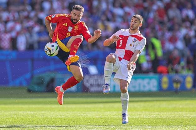 2024-06-15 Spain v Croatia - Group B - UEFA EURO, EM, Europameisterschaft,Fussball 2024 BERLIN, GERMANY - JUNE 15: Dani Carvajal of Spain, Andrej Kramaric of Croatia battle mid-air during the Group B - UEFA EURO 2024 match between Spain and Croatia at Olympiastadion on June 15, 2024 in Berlin, Germany. (Photo by Peter Lous BSR Agency) Berlin Germany Content not available for redistribution in The Netherlands directly or indirectly through any third parties. Copyright: xBSRxAgencyx