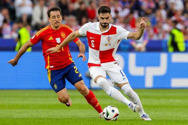 Spain v Croatia: Group B - UEFA EURO, EM, Europameisterschaft,Fussball 2024 BERLIN, GERMANY - JUNE 15: Josip Sutalo of Croatia is challenged by Mikel Oyarzabal of Spain during the UEFA EURO 2024 group stage match between Spain and Croatia at Olympiastadion on June 15, 2024 in Berlin, Germany. LukaxStanzl PIXSELL