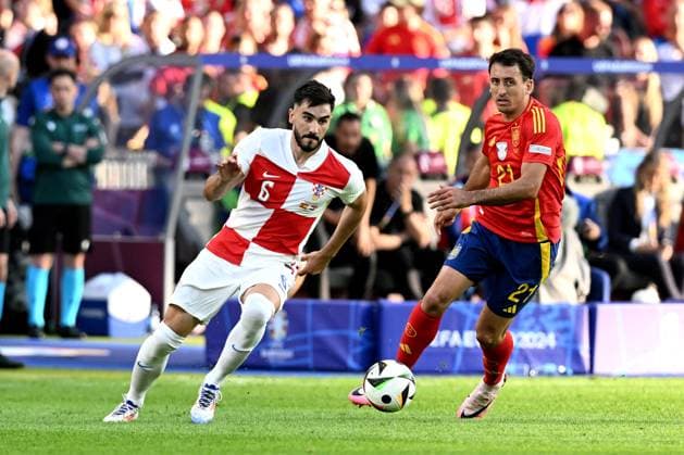 Spain v Croatia: Group B - UEFA EURO, EM, Europameisterschaft,Fussball 2024 BERLIN, GERMANY - JUNE 15: Josip Sutalo of Croatia competes for the ball with Mikel Oyarzabal of Spain during the UEFA EURO 2024 group stage match between Spain and Croatia at Olympiastadion on June 15, 2024 in Berlin, Germany. MarkoxLukunic PIXSELL