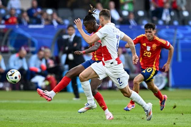 Spain v Croatia: Group B - UEFA EURO, EM, Europameisterschaft,Fussball 2024 BERLIN, GERMANY - JUNE 15: Nico Williams of Spain shoots whilst under pressure of Josip Stanisic of Croatia during the UEFA EURO 2024 group stage match between Spain and Croatia at Olympiastadion on June 15, 2024 in Berlin, Germany. MarkoxLukunic PIXSELL