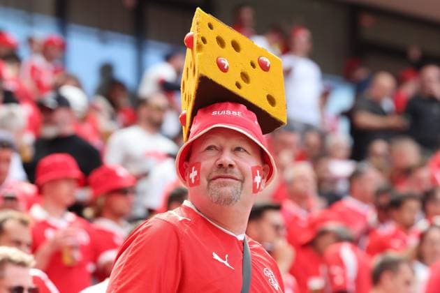 Swiss fan with a cheese as a hat, Swiss football fan with cheese hat, Preliminary round match M02, HUN SUI, , European Football Championship, Hungary vs Switzerland, European Football Championship, Hungary vs Swiss, Cologne, Cologne, 15 06 2024,