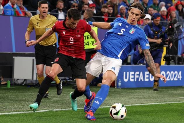 Dortmund, Germany, 15th June 2024. Riccardo Calafiori of Italy dispossesses Jasir Asani of Albania during the UEFA European Championships match at BVB Stadion, Dortmund. Picture credit should read: Jonathan Moscrop Sportimage EDITORIAL USE ONLY. No use with unauthorised audio, video, data, fixture lists, club league logos or live services. Online in-match use limited to 120 images, no video emulation. No use in betting, games or single club league player publications. SPI-3182-0019