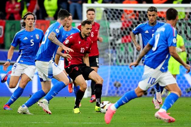 Nedim Bajrami of Albania surrounded by italian players during the Euro 2024 Group Stage B football match between Italy and Albania at BVB Stadium in Dortmund (Germany), June 15th, 2024. cesarexpurini