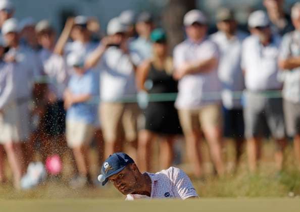 Bryson DeChambeau shoots out of a bunker to the tenth green during the third round of the 124th U.S. Open golf championship at Pinehurst Resort & Country Club in Pinehurst, N.C. on Saturday, June 15, 2024.  NCP20240615337 JOHNxANGELILLO